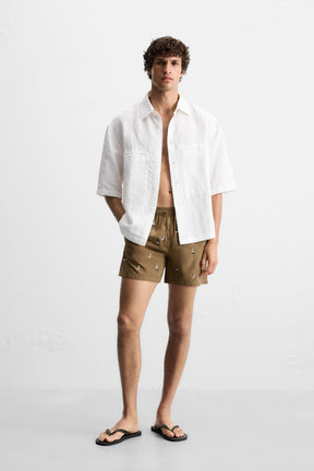 EMBROIDERED MID-LENGTH SWIMMING TRUNKS - Image 1