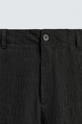 REGULAR FIT TROUSERS WITH IRREGULAR TEXTURE - Image 9