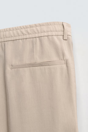 FLOWING PLEATED TROUSERS - Image 10