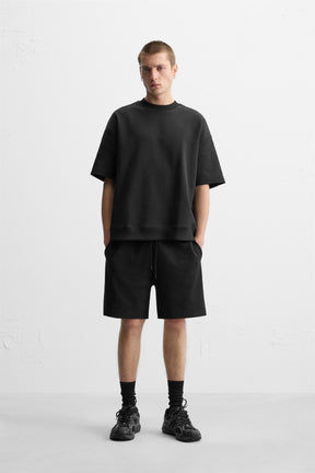 TECHNICAL INTERLOCK BERMUDA SHORTS - Image 1