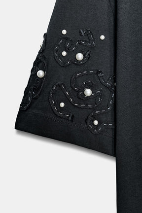 Besticktes Perlenhemd