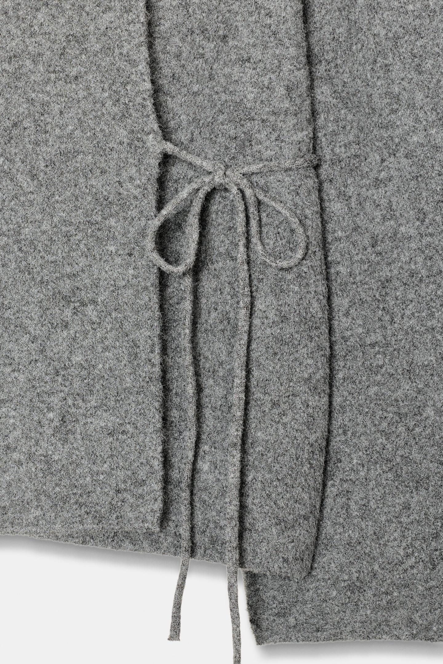 Strickjacke mit Schlitzärmeln 