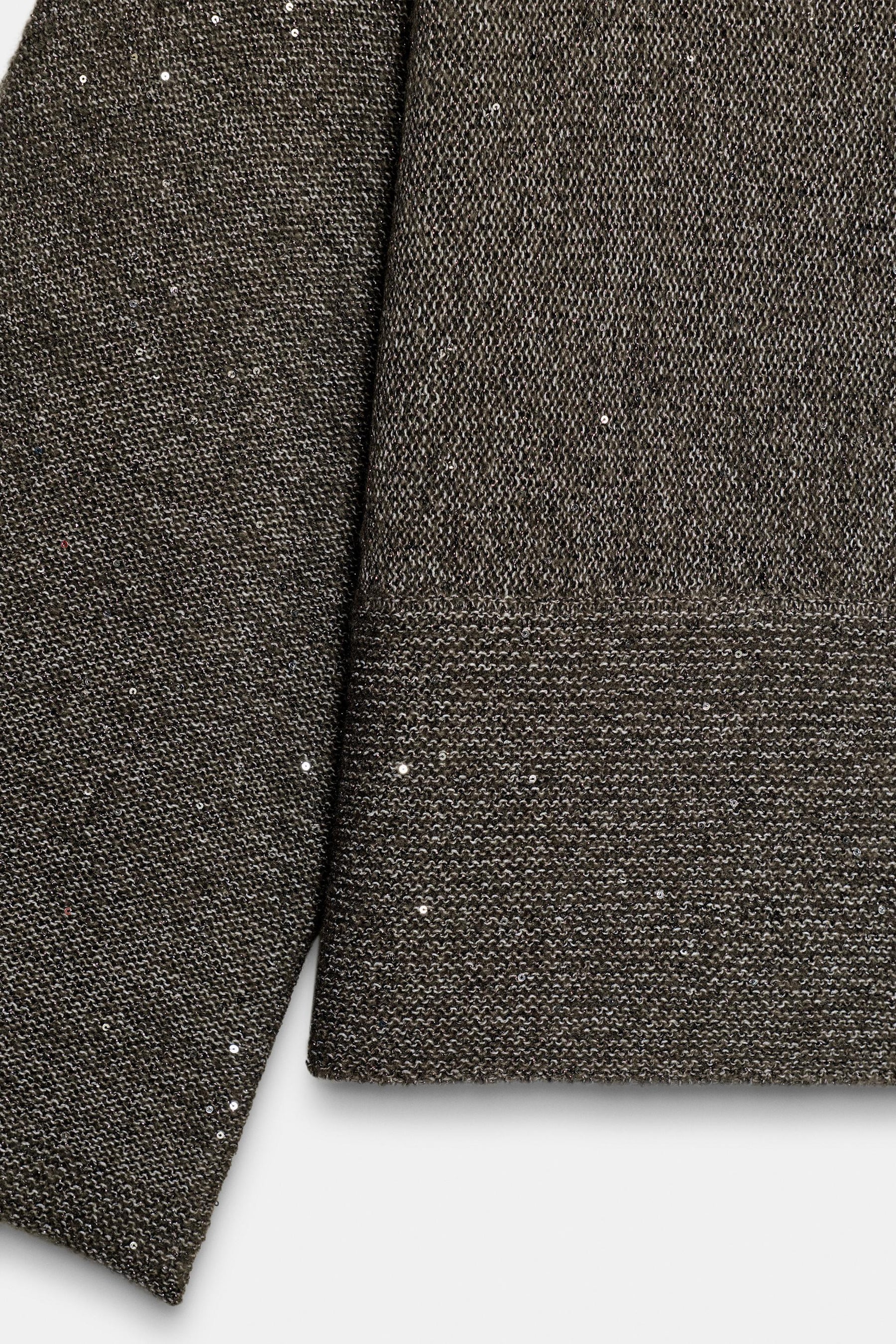 Paillettenstrickpullover