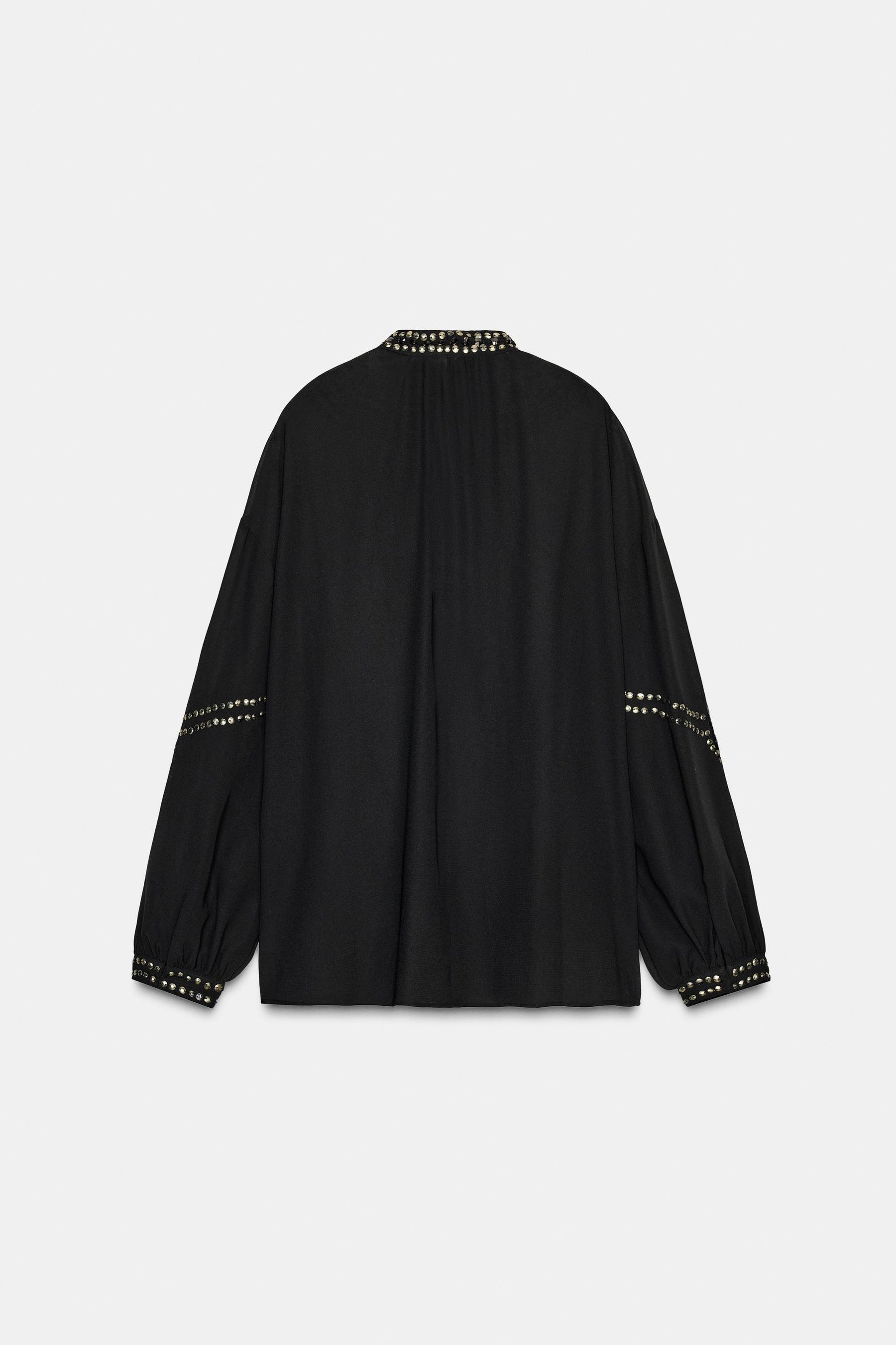 Perlenbesetzte, halbtransparente Bluse