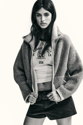 Strickjacke mit kontrastierendem Besatz