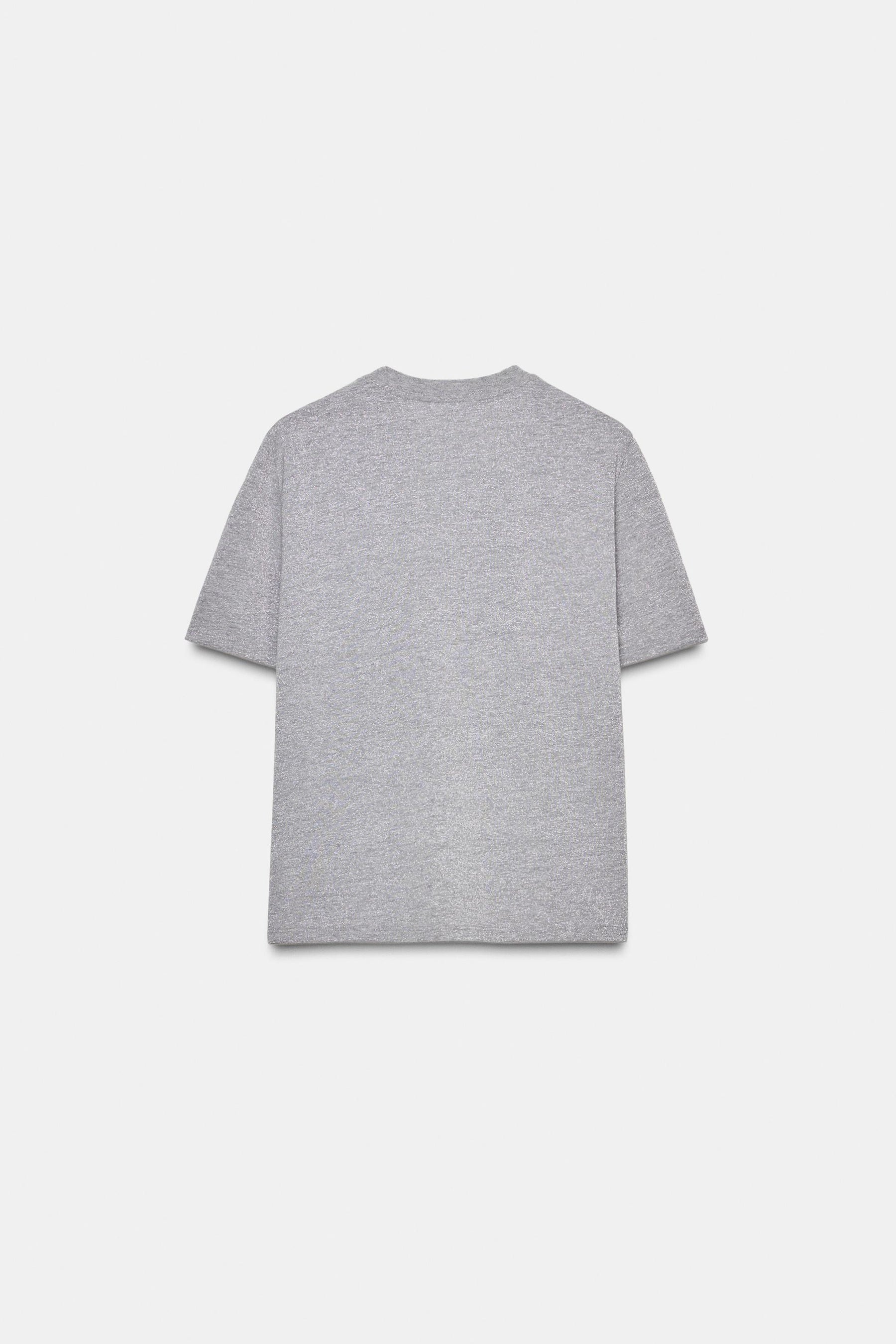 T-SHIRT MIT SCHIMMERTEXT