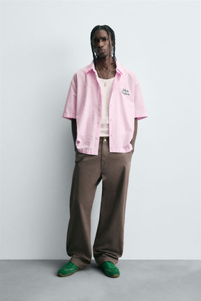 STRIPED SHIRT WITH CONTRAST SLOGAN - Image 1