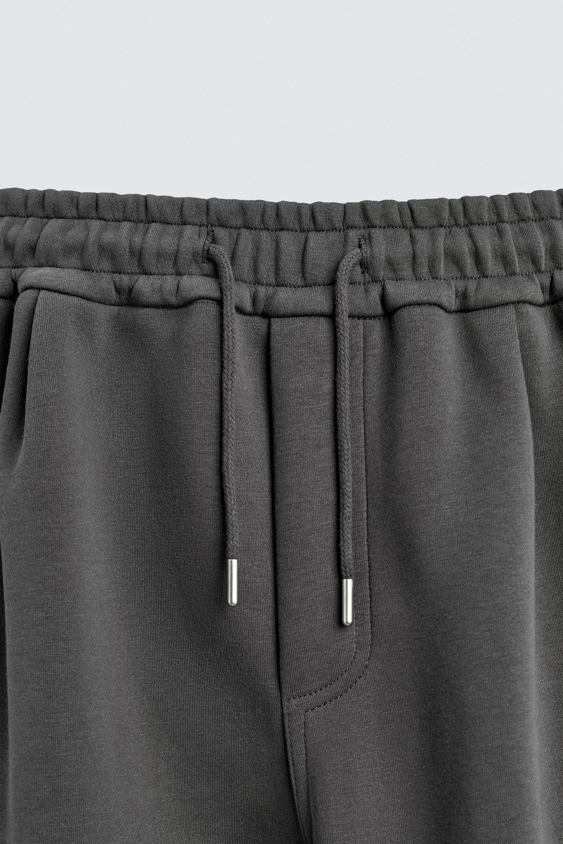 NEOPRENE-EFFECT PLEATED CARGO TROUSERS - Image 7