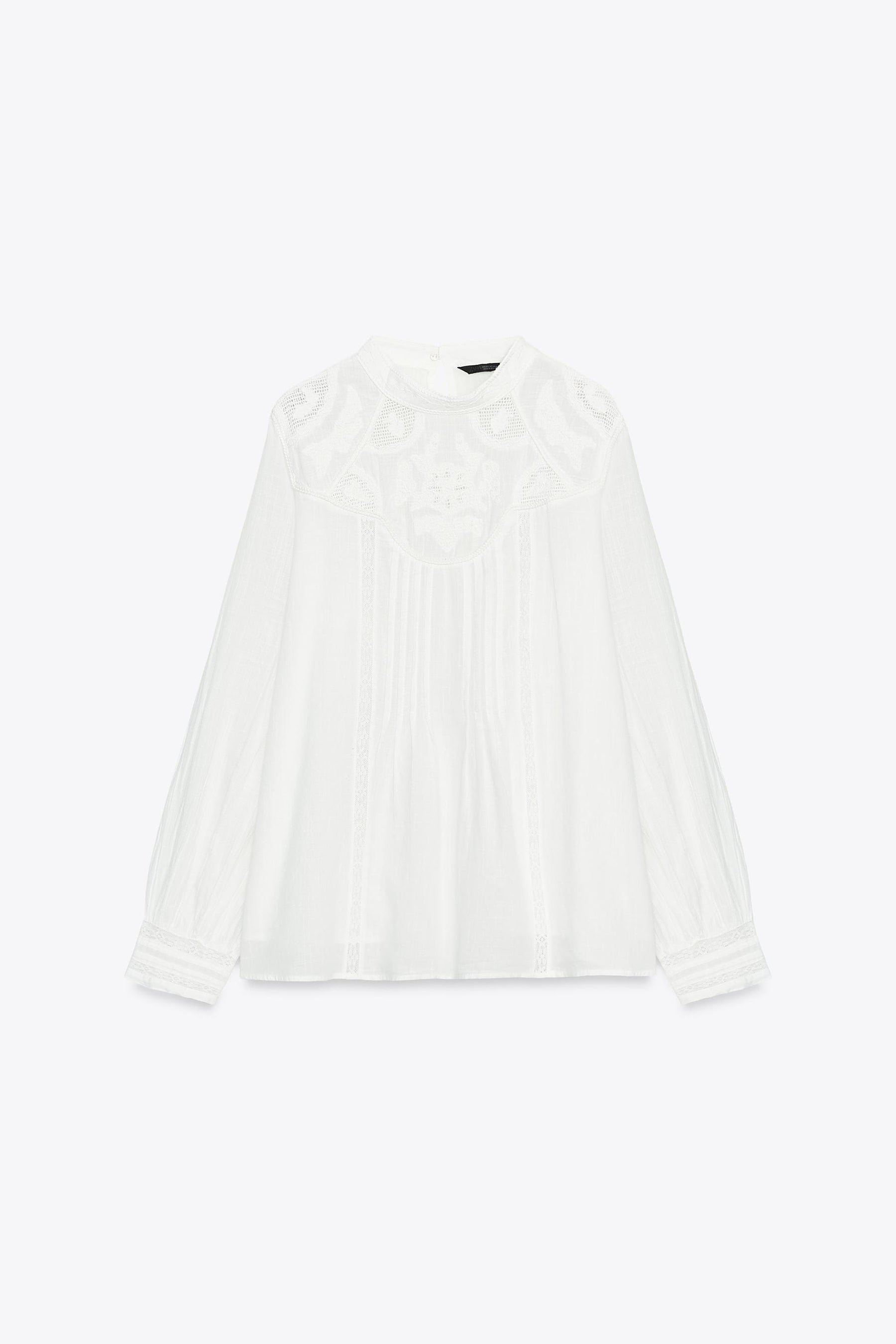 BLUSE MIT BLUMENSTICKUNG