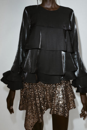 Bluse aus schimmerndem Rüschenstoff