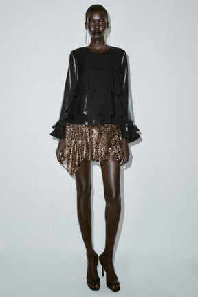 Bluse aus schimmerndem Rüschenstoff