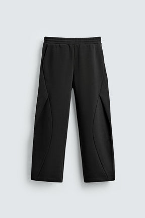 NEOPRENE-EFFECT PLEATED BALLOON FIT TROUSERS - Image 6