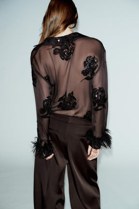 Paillettenbluse mit Federn