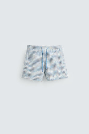 GEOMETRIC PRINT MID-LENGTH SWIMMING TRUNKS - Image 1