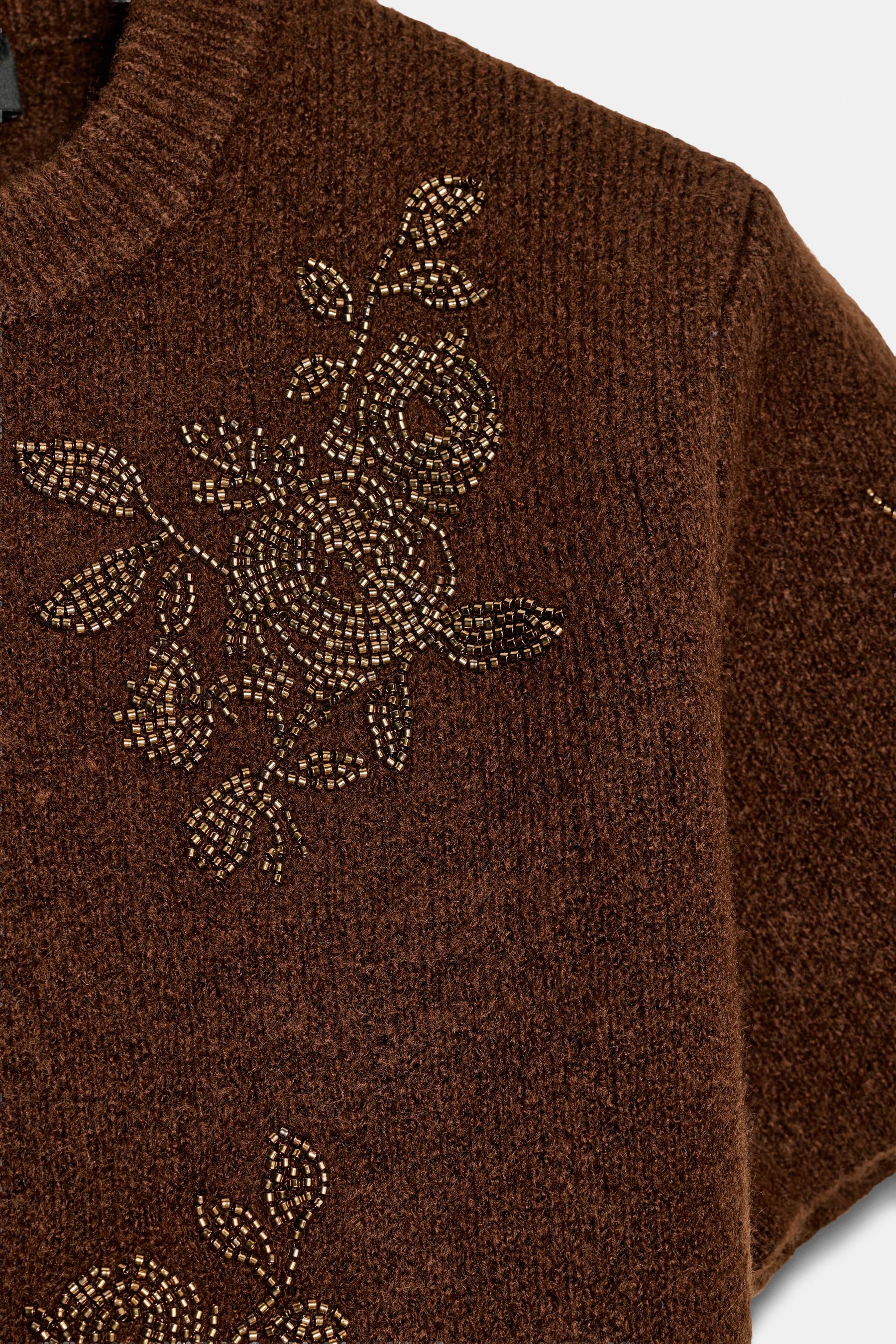 Kurzarmpullover mit Perlenbesatz