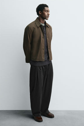 LEATHER MOCCASIN WITH MASK DETAIL - Image 1